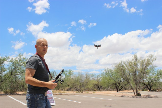 John Malozsak, a real estate agent, flies one of his drones in the desert near Sahuarita.  